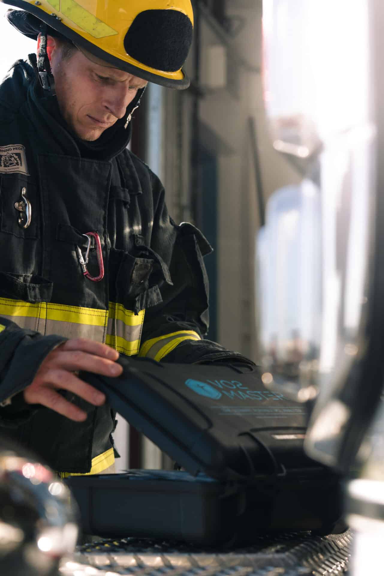 Firefighter in full gear using a VO2Master Analyzer