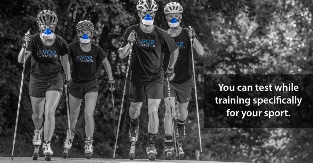 a team of 4 cross country ski athletes practice on roller blades while wearing the v02 master analyzer masks.
