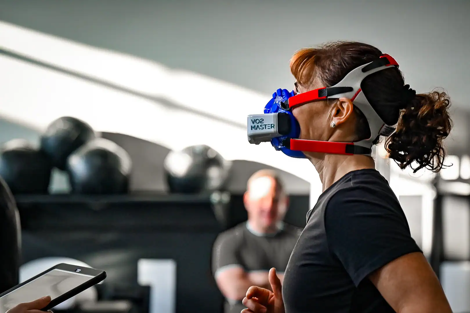 Runner wearing VO2 Master device during performance assessment and metabolic testing.