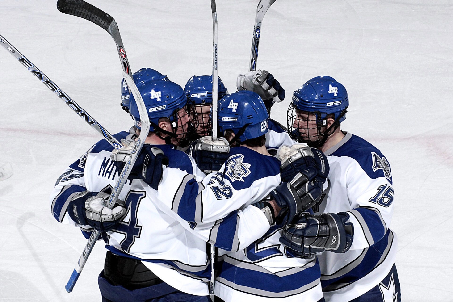 NHL hockey players huddling in rink