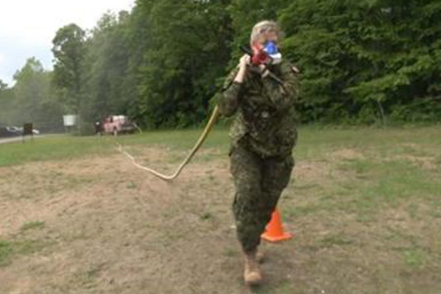 Woman training for military with rope and VO2 analyzer