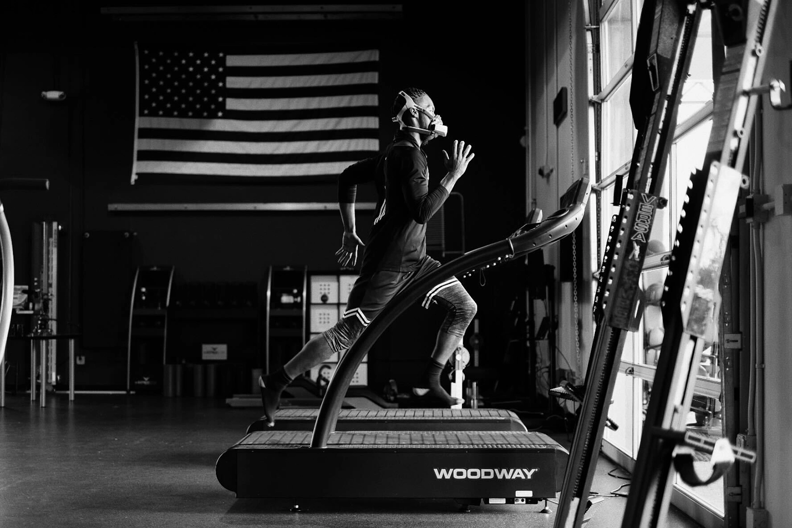 Athlete running on treadmill wearing portable metabolic testing system during VO2 max testing at Exos Human Performance Lab.