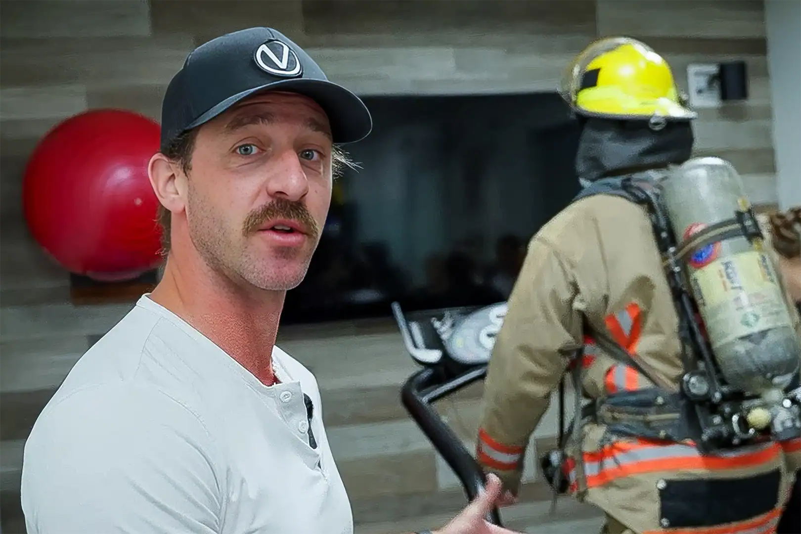 Firefighter performing treadmill VO2 max testing in full gear using portable metabolic testing equipment for duty readiness assessment.