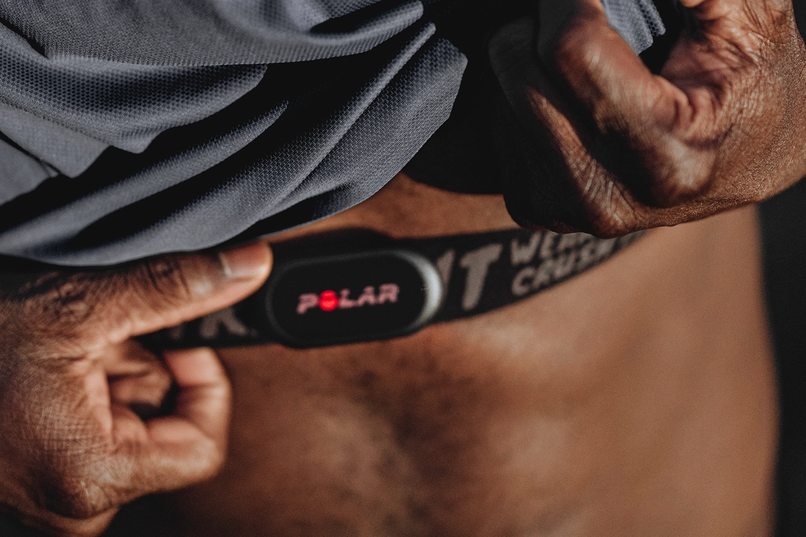 Close-up of a Polar H10 chest strap heart rate monitor used during exercise recovery testing in a VO2 tactical study.