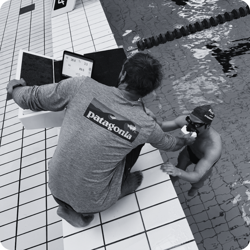 a swimmer being tested poolside with the vo2 master portable metabolic analyzer with results being displayed on an ipad