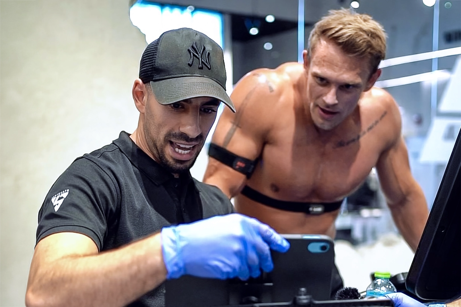 Fitness professional and coach from Septovate reviewing performance data with a client to support personalized fitness goals and motivation.