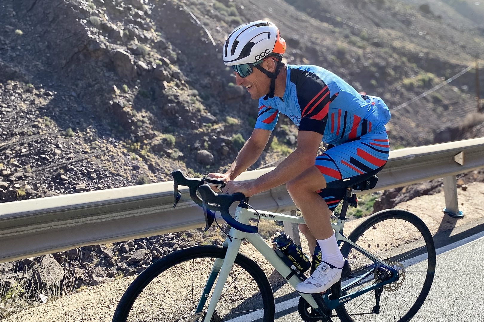 Dr. Andrew Sellars cycling outdoors for sport-specific endurance training.
